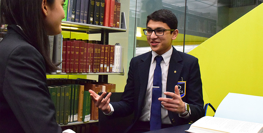 Washington State Deca president speaking to someone in a happy mood