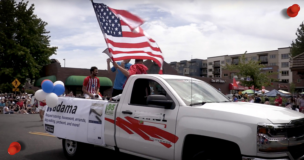 Kadama team on top of a truck promoting the company during the Kirkland 4th of July Parade