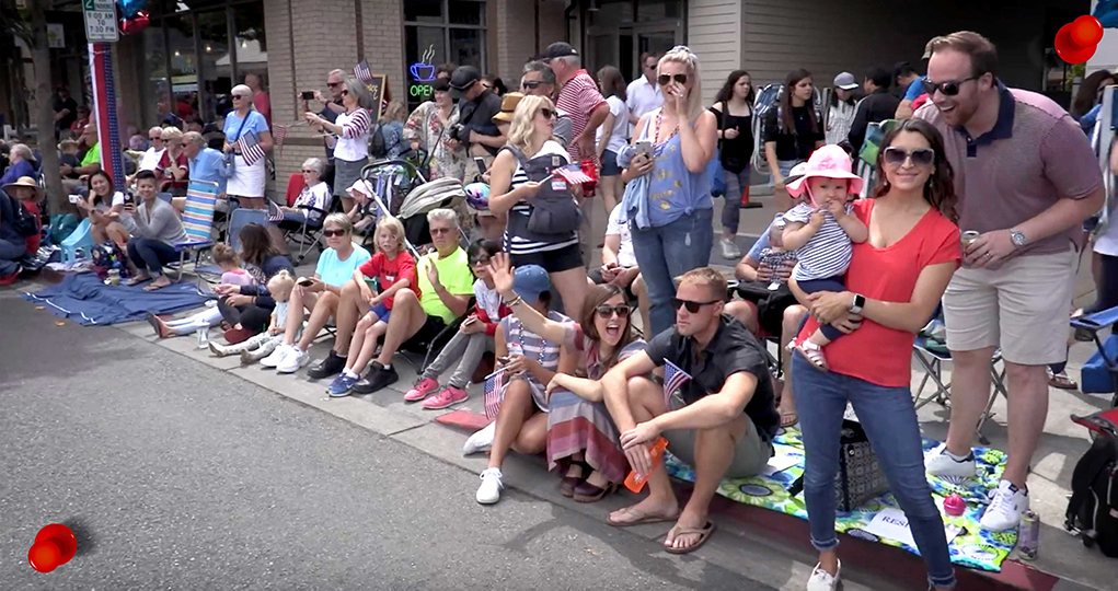 Community members cheering on the Kadama team during the Kirkland 4th of July parade